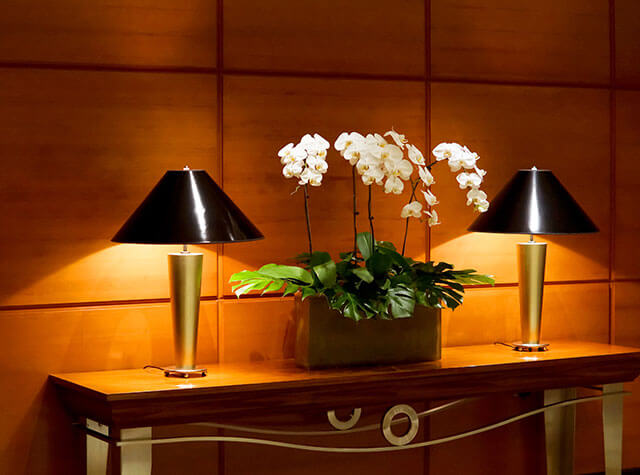 Hotel table with flowers and lights